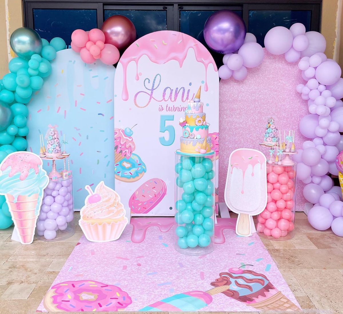 Ice cream–themed 5th birthday with three arch backdrops